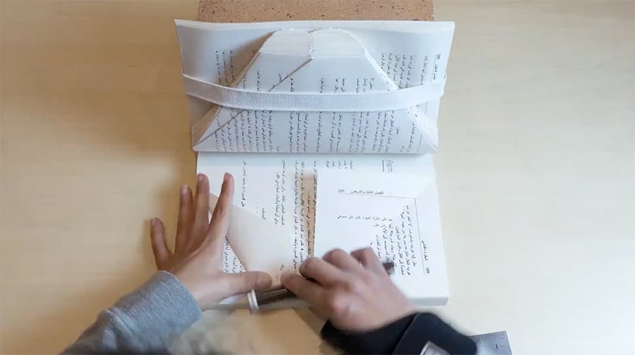 dina amin - folding the talking book pages