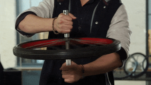 Spinning Bike Wheel and Conservation of Angular Momentum | The Kid Should  See This
