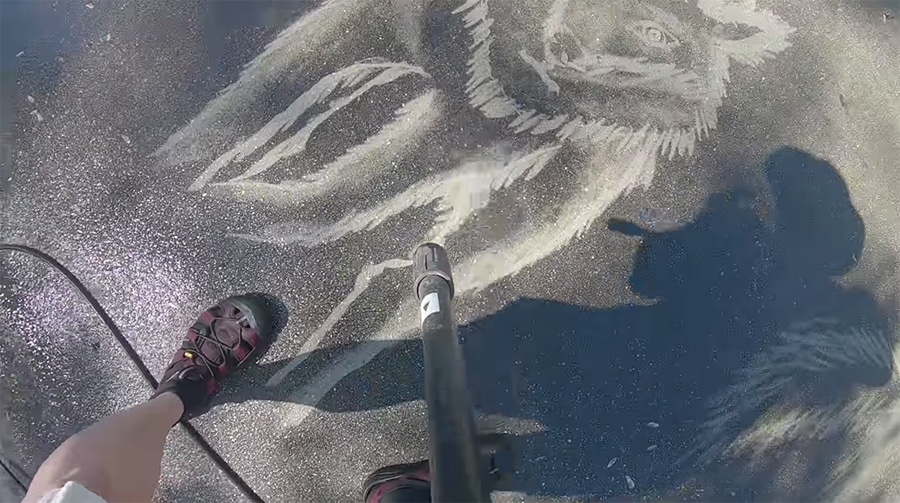 sketching a wolf with a power washer