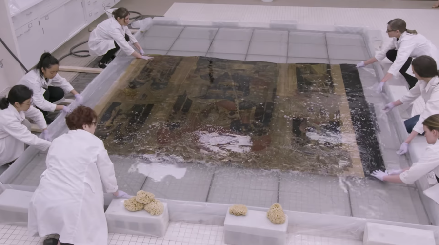 washing the tapestry with the conservation team